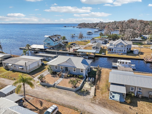 birds eye view of property with a water view