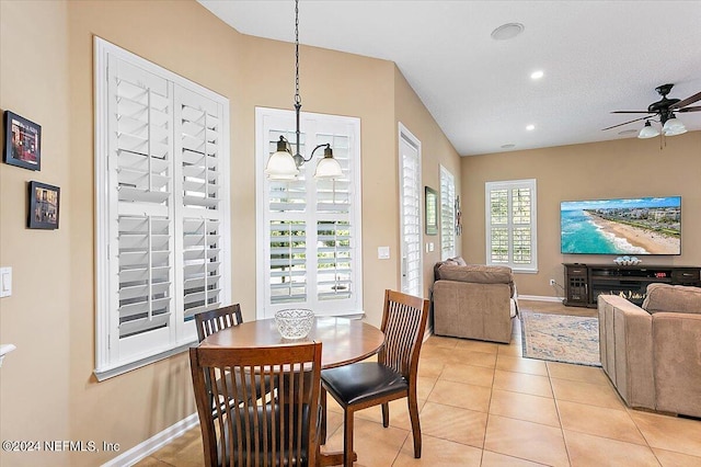 tiled dining space with ceiling fan