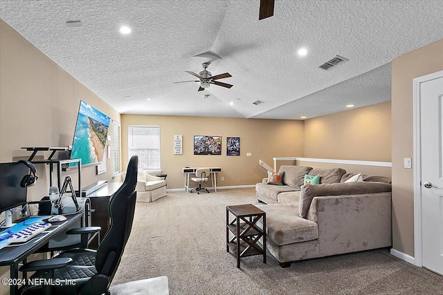 living room featuring vaulted ceiling, carpet flooring, a textured ceiling, and ceiling fan