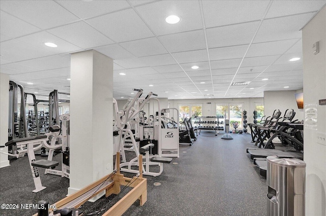 exercise room with a paneled ceiling