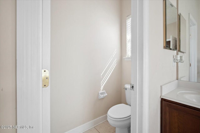 bathroom with tile patterned floors, toilet, and vanity