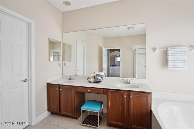 bathroom with vanity, tile patterned floors, and independent shower and bath