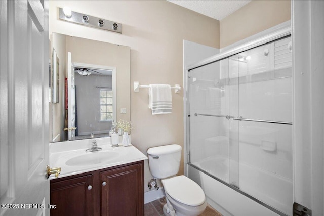 full bathroom with vanity, combined bath / shower with glass door, and toilet