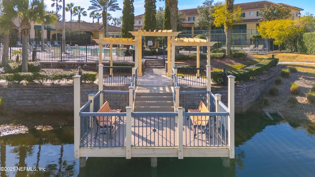 view of dock with a water view and a pergola