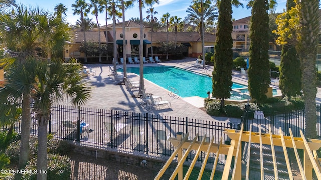 view of swimming pool with a patio area