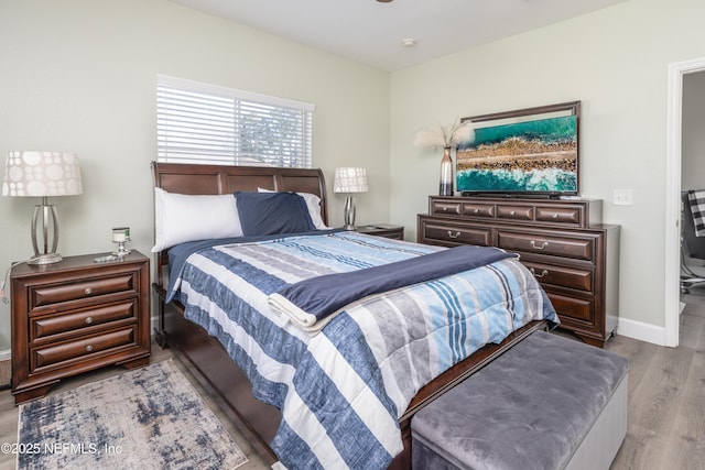 bedroom with light wood-type flooring