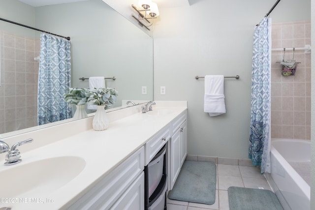 bathroom with tile patterned flooring, vanity, and shower / tub combo