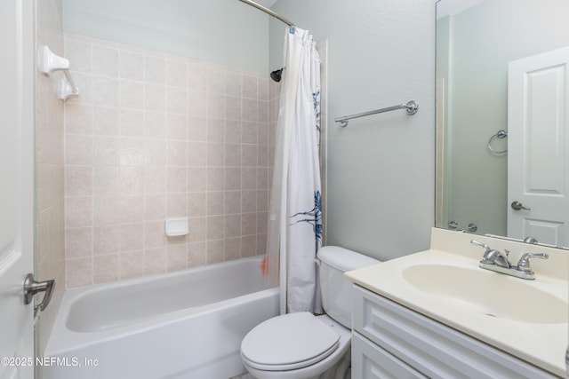 full bathroom featuring vanity, shower / bath combination with curtain, and toilet