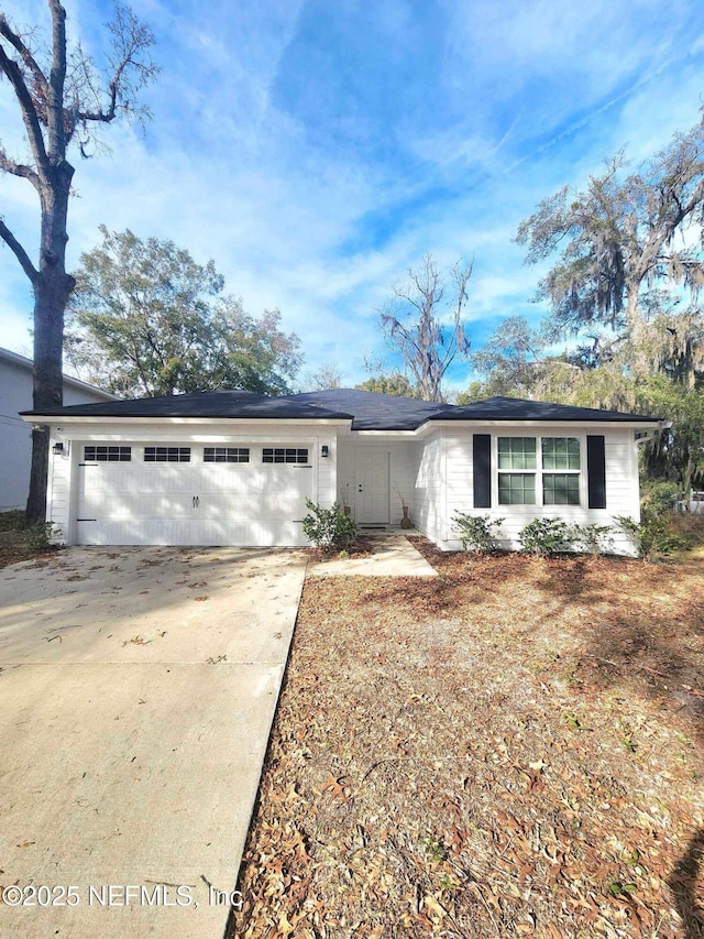 ranch-style house featuring a garage