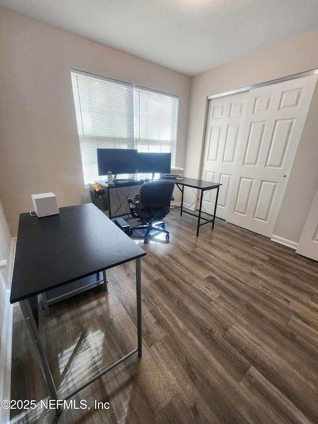 office with wood finished floors and baseboards