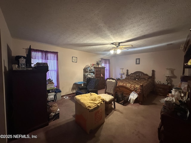 bedroom featuring ceiling fan, carpet, and a textured ceiling