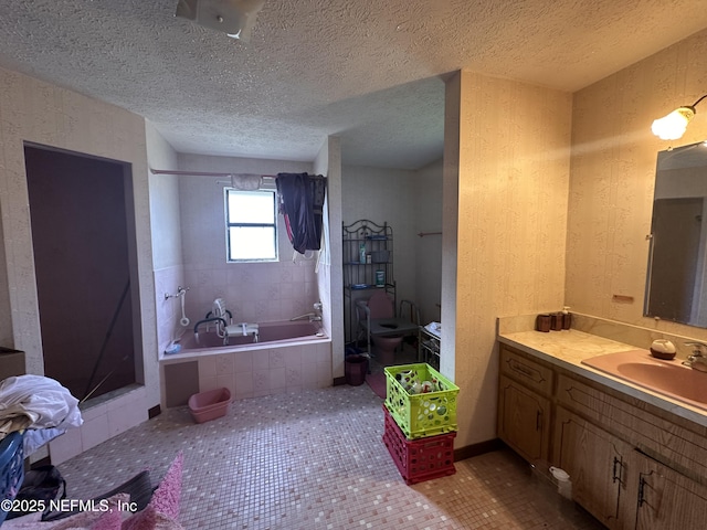 bathroom featuring vanity, tile patterned floors, plus walk in shower, and a textured ceiling