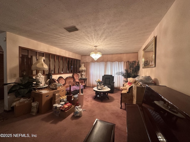 interior space featuring a textured ceiling, carpet, and a notable chandelier