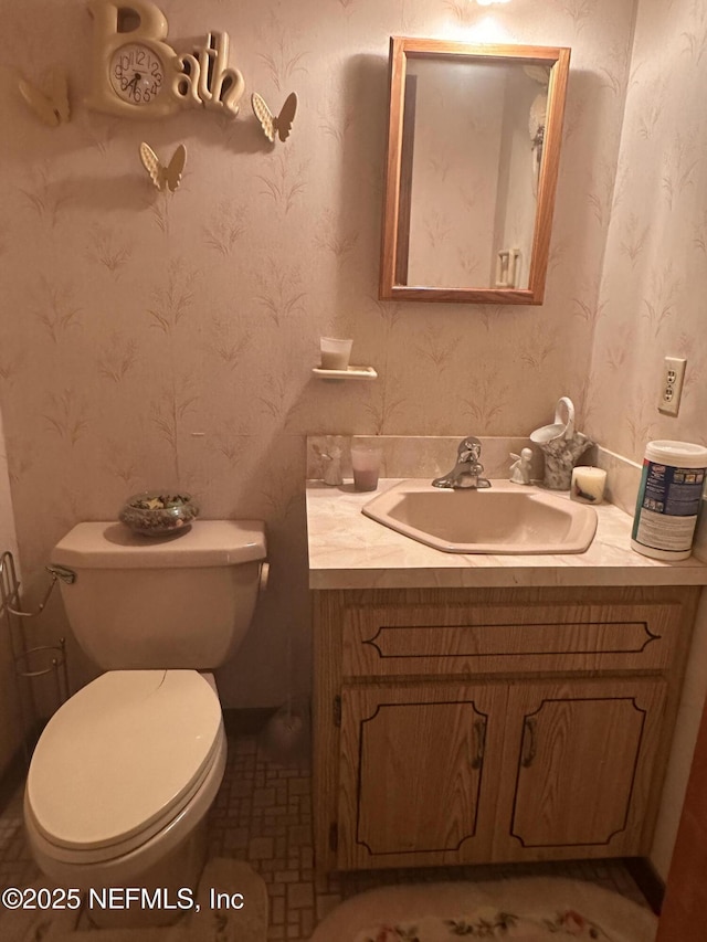 bathroom with vanity and toilet