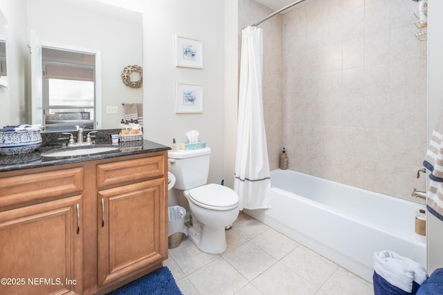 full bathroom featuring shower / bath combination with curtain, tile patterned floors, toilet, and vanity