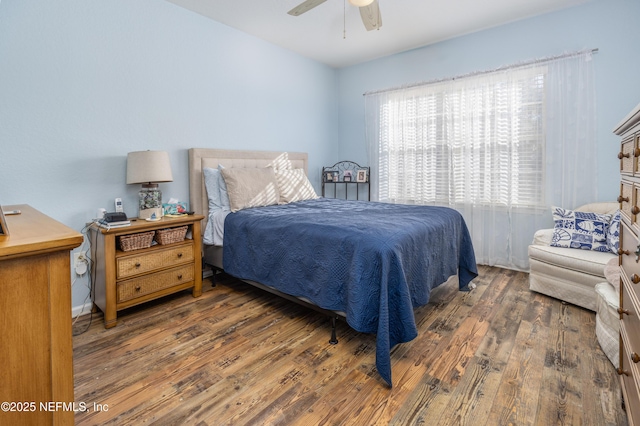 bedroom featuring dark wood-type flooring and ceiling fan