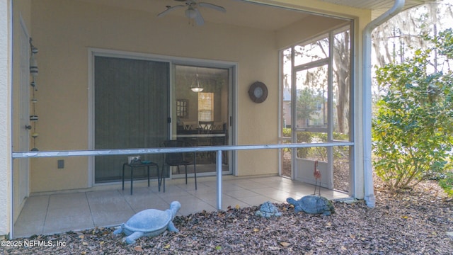 exterior space with ceiling fan