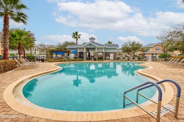 view of swimming pool with a patio area