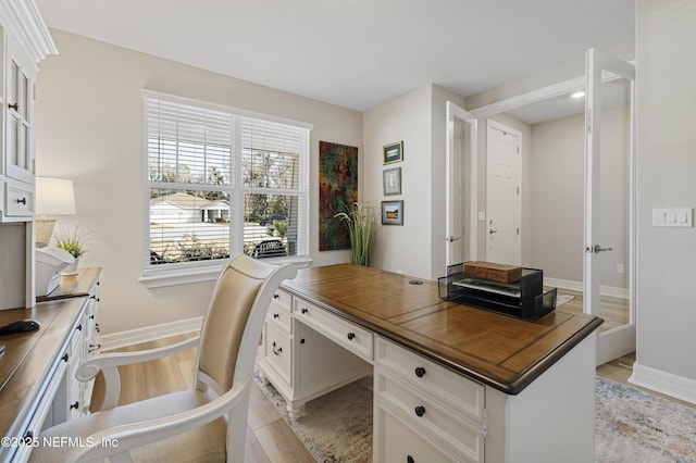 office area with light hardwood / wood-style flooring