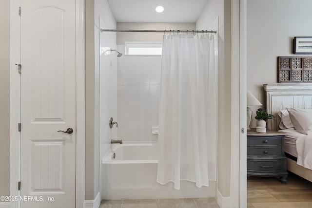 bathroom with tile patterned flooring and shower / bathtub combination with curtain