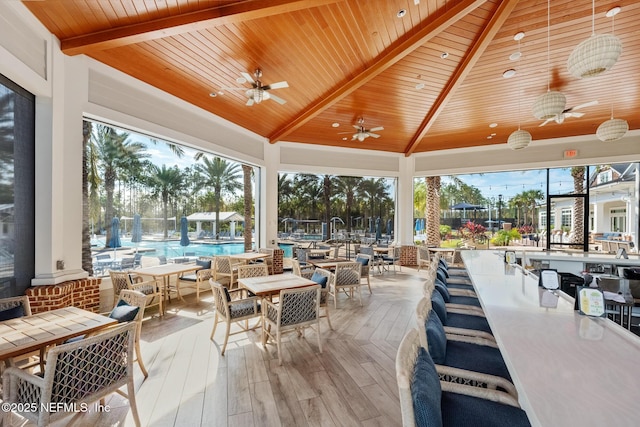 view of patio / terrace with a gazebo, ceiling fan, and a community pool