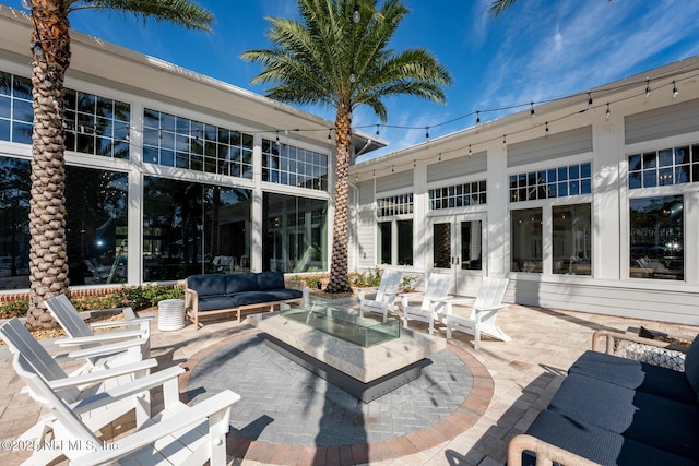 view of patio / terrace with an outdoor living space and french doors