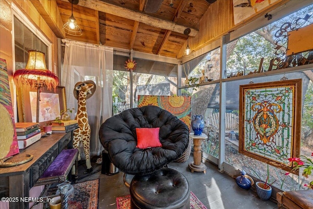 sunroom with lofted ceiling and wooden ceiling