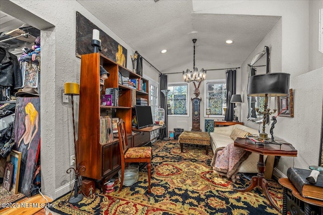 office featuring vaulted ceiling, hardwood / wood-style floors, a notable chandelier, and a textured ceiling