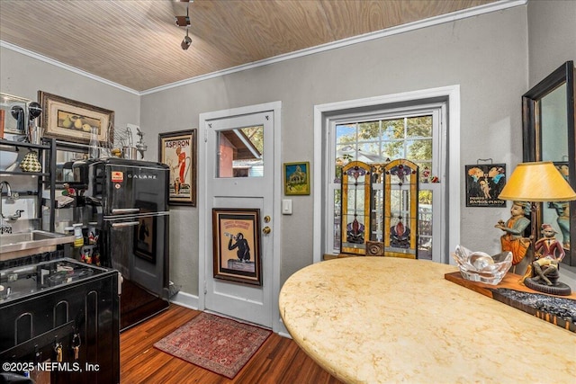 kitchen with hardwood / wood-style floors and ornamental molding