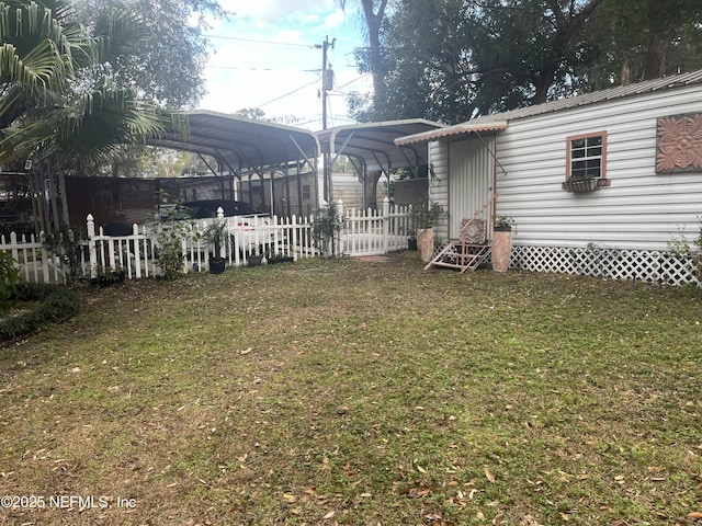 view of yard with a carport