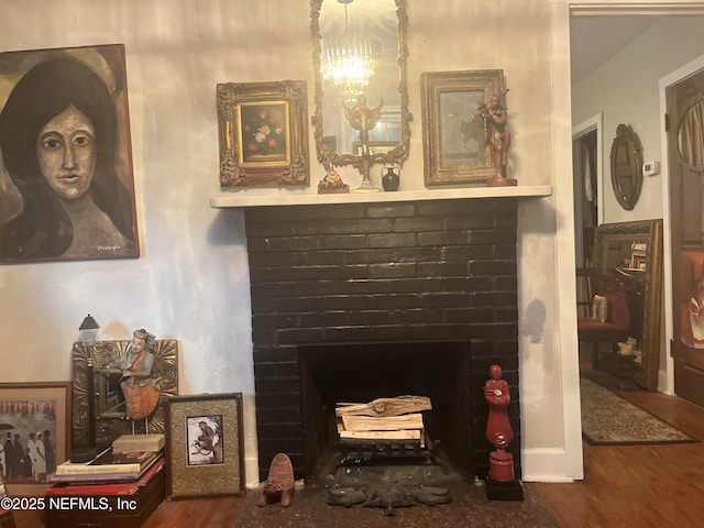 details featuring wood-type flooring and a brick fireplace