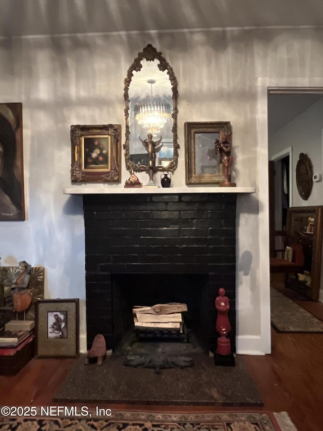 details featuring hardwood / wood-style flooring and a chandelier