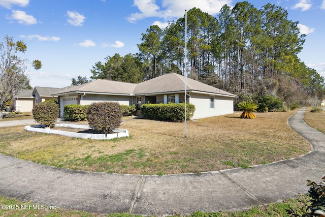 view of side of home with a garage and a yard