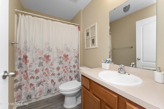 bathroom with vanity, toilet, a shower with shower curtain, and wood-type flooring