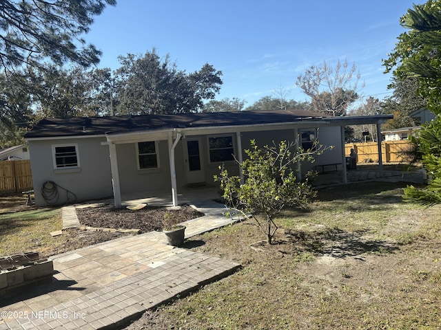 rear view of house featuring a patio