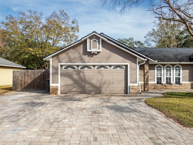 ranch-style house featuring a garage