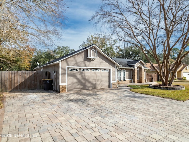 ranch-style house featuring a garage