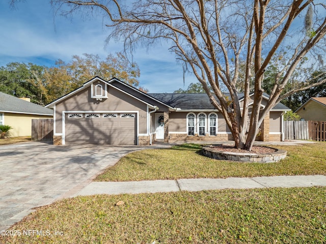 ranch-style home with a garage and a front yard