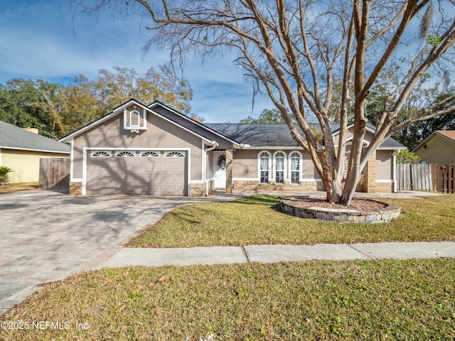 ranch-style house with a garage and a front yard