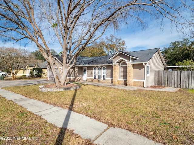 view of front of home featuring a garage and a front lawn