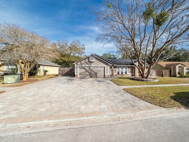 view of front facade with a garage and a front lawn