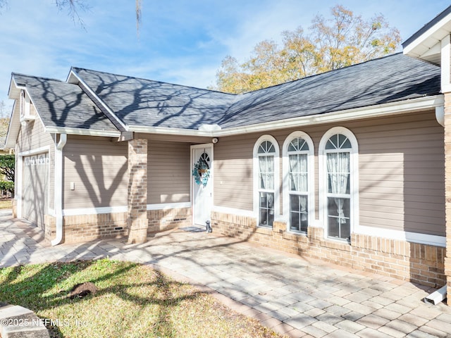 property entrance with a garage