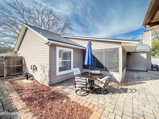 back of house with a patio