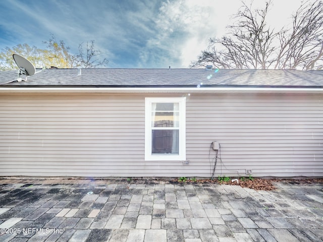 view of side of home with a patio area