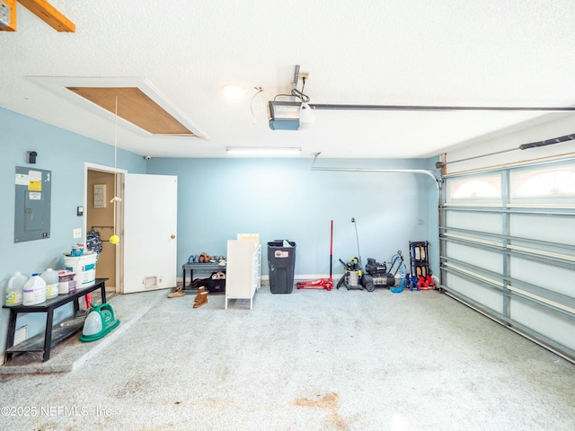 garage with a garage door opener and electric panel