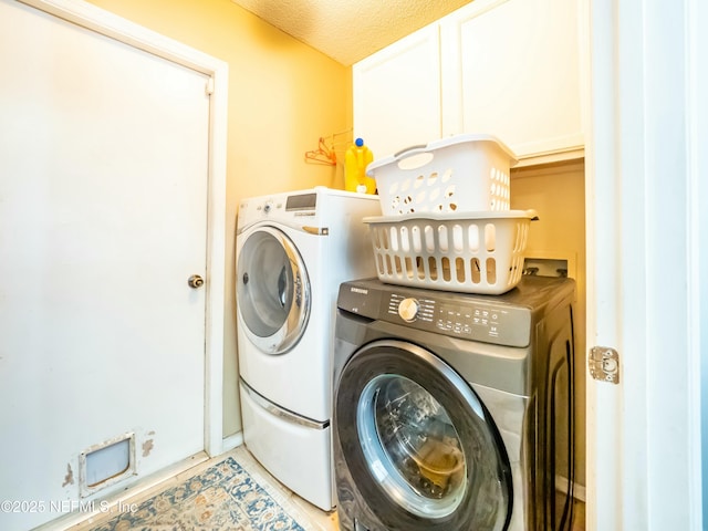 laundry room with independent washer and dryer