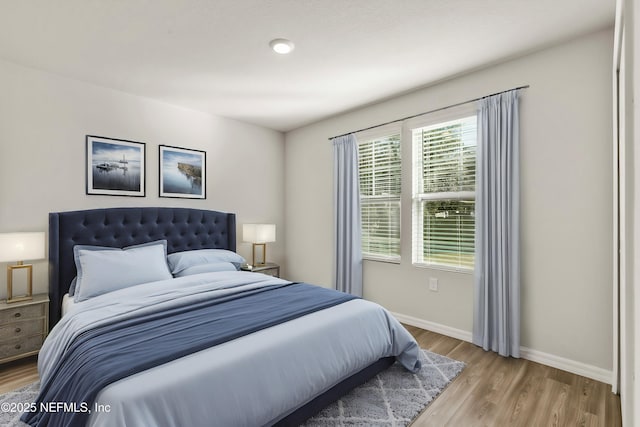 bedroom with light hardwood / wood-style flooring