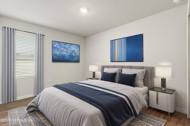 bedroom with hardwood / wood-style flooring