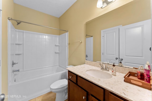 full bathroom with tile patterned floors, toilet, a textured ceiling, vanity, and shower / washtub combination