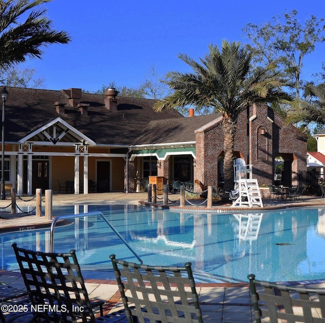 view of pool featuring a patio area